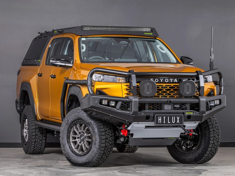 toyota hilux n90 2026 sunglow orange with ironman 4x4 apex bull bar front three quarter angle gallery