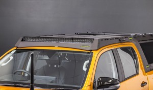 toyota hilux n90 2026 sunglow orange with ironman 4x4 raid roof rack eye level angle