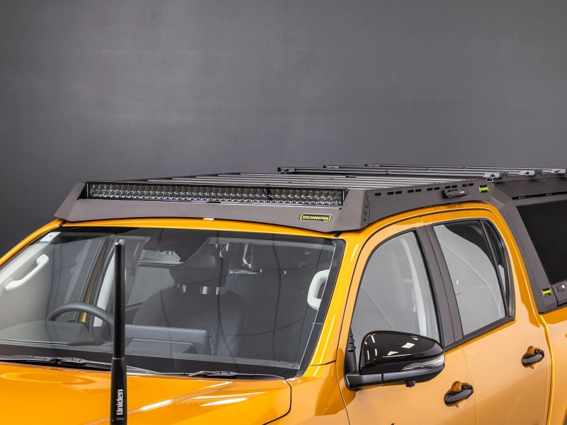 toyota hilux n90 2026 sunglow orange with ironman 4x4 raid roof rack eye level angle